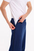 Person wearing navy blue pants with a white shirt on a white background Adaptive Bedbound Patient Care Trousers Zip-Open Inseam 1