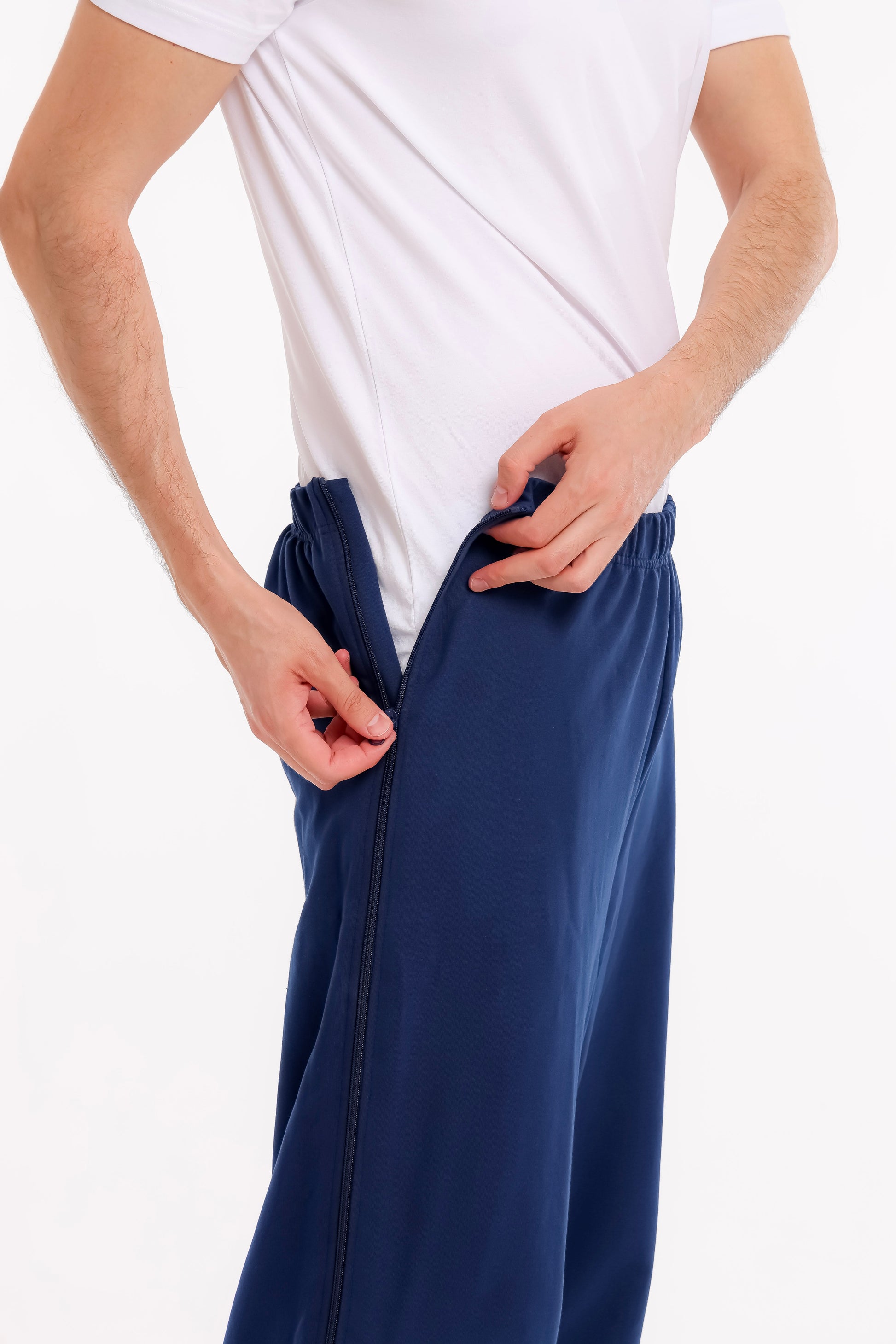 Person wearing navy blue pants with a white shirt on a white background Adaptive Bedbound Patient Care Trousers Zip-Open Inseam 1